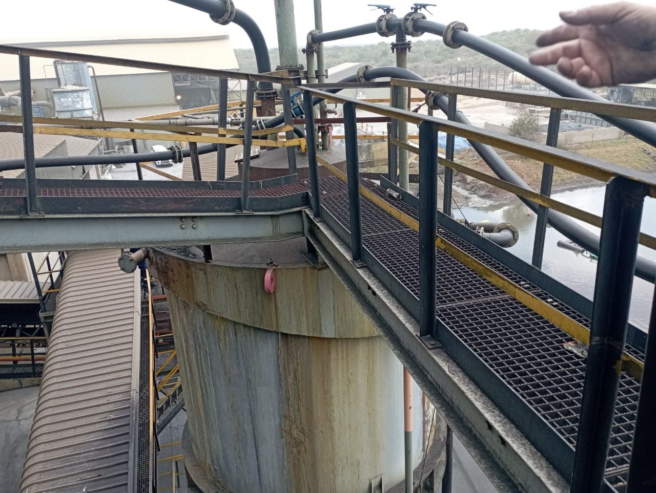 Steel walkway and HDPE pipework at a mine processing plant